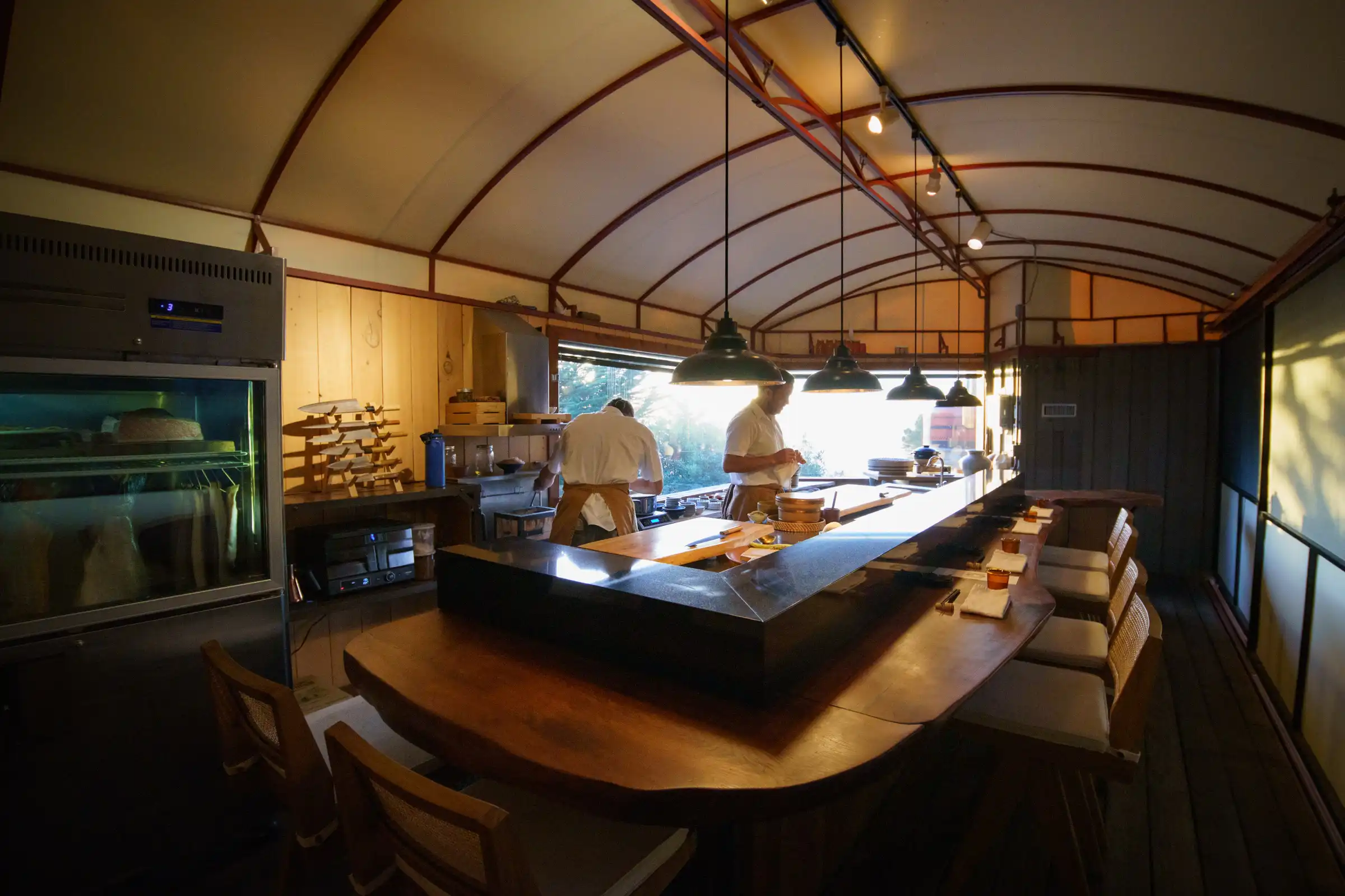 Wild Coast Sushi interior, open kitchen with chefs at the counter