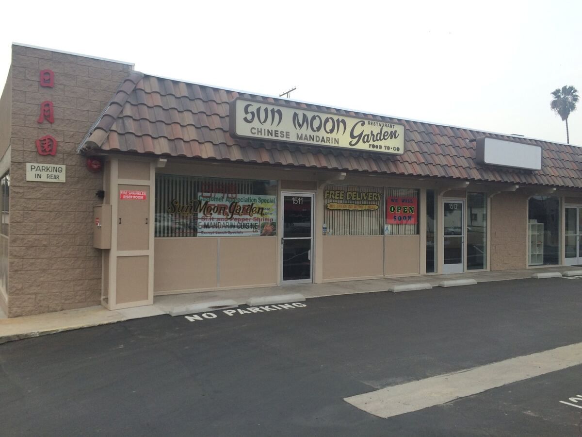 The restored Burbank plaza frontage with new tile roof, stucco and tenant signage